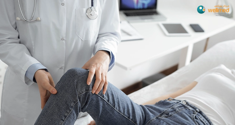 Doctor examining patient's knee.